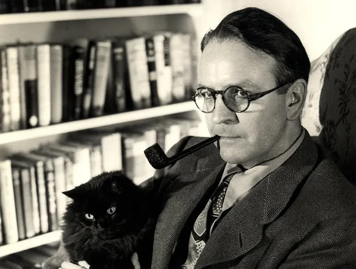 black and white photo of Raymond Chandler holding his cat
