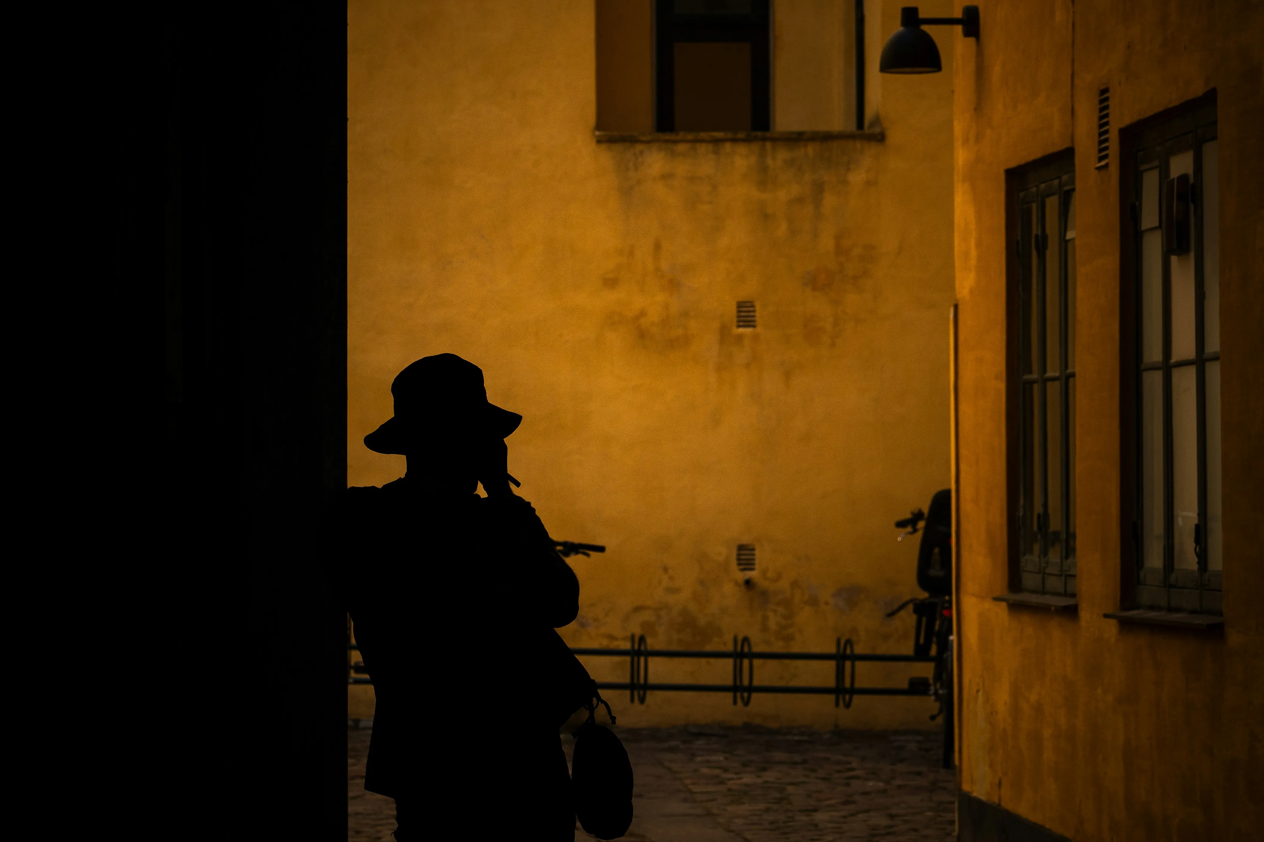 a mysterious detective standing in the street
