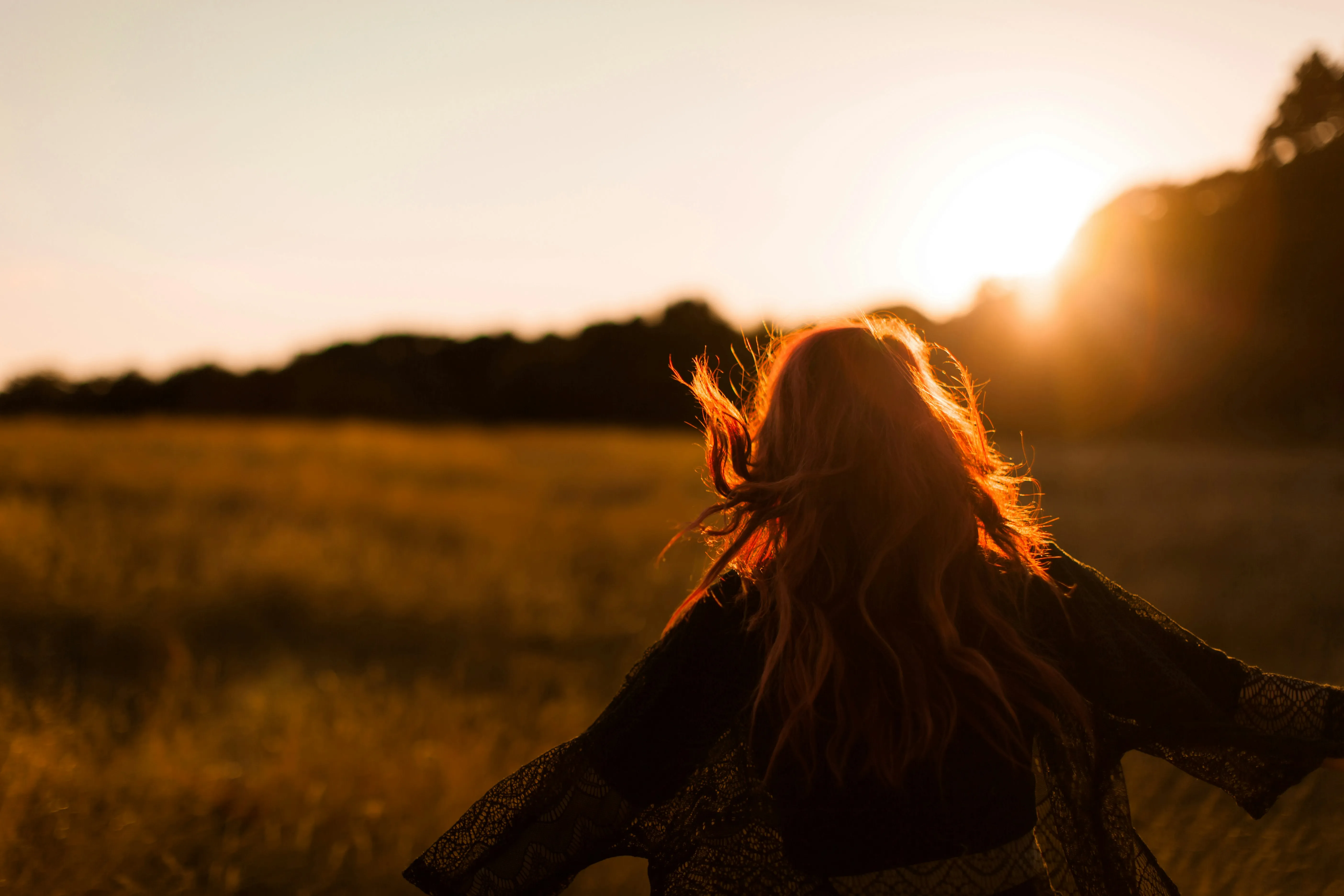 a woman dancing in the field