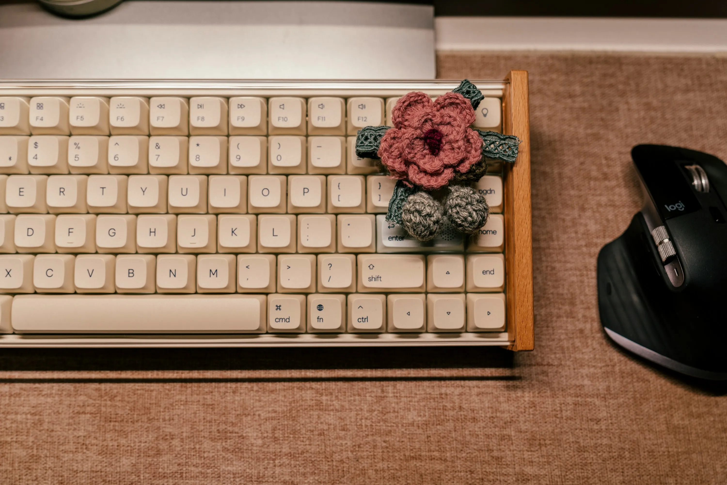 keyboard and a knitted flower on it